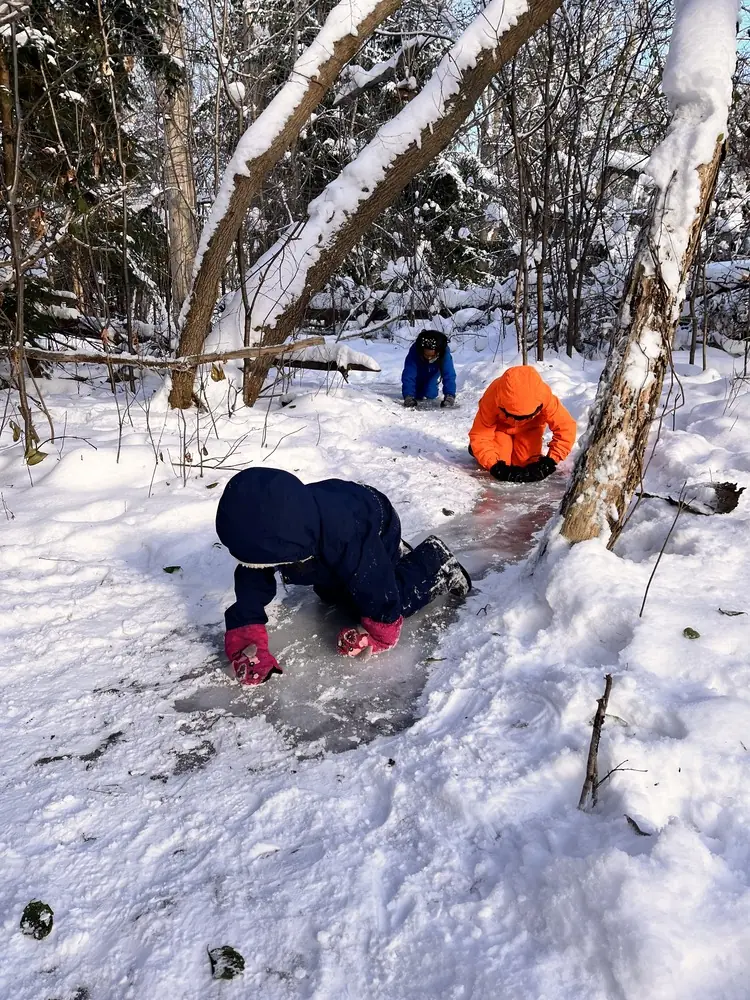 Children playing in the snow at Lakeside Park